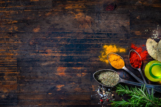istock Cooking and seasoning culinary background on wooden table with copy space 1419288538