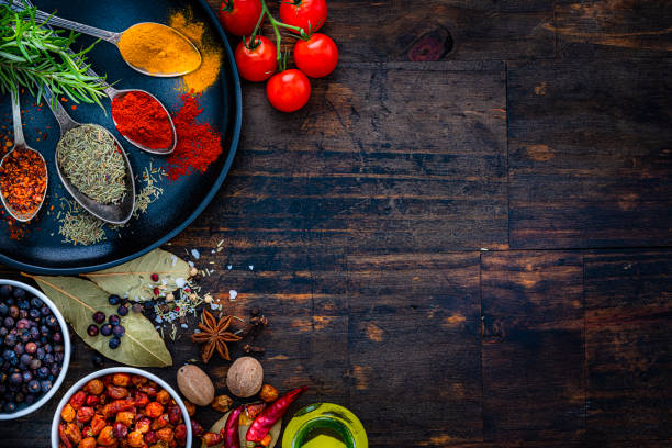 istock Scentederbs and spices frame on wooden table 1419288540