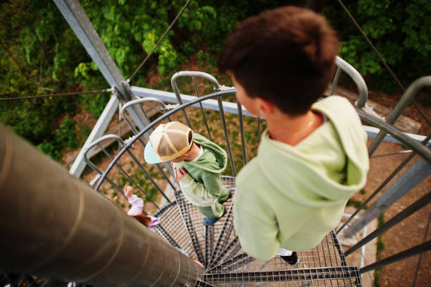 istock Kids at viewing tower. Watchtower during sunset. 1419291096