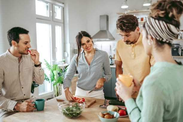 istock Group of young beautiful people making a meal in the kitchen 1419292187