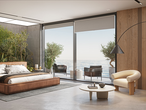 3d render of large bedroom in a luxury resort with sea view. Digitally generated image of luxurious resort bedroom.