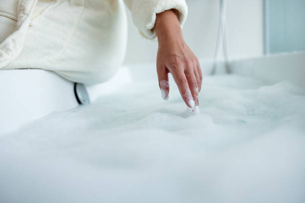 istock Woman Preparing A Bubble Bath At Home 1419292798