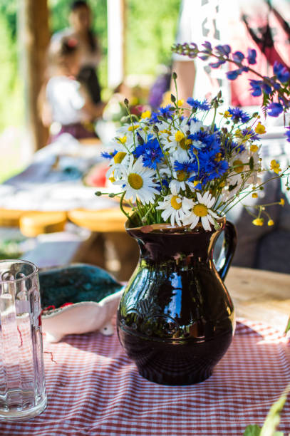 istock Ceramic water jug with wildflowers 1419293622