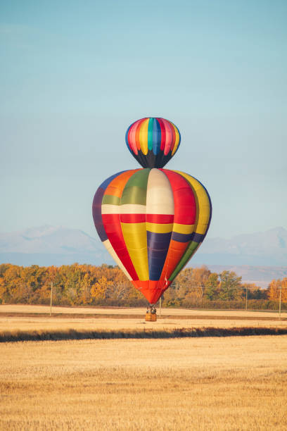 istock Two hot air balloons flying past each other 1419294190