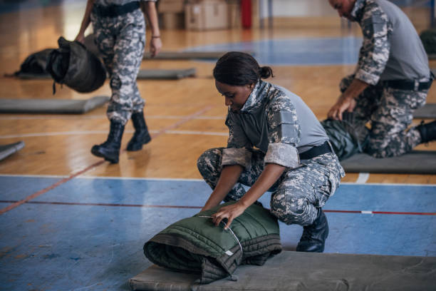istock Soldiers preparing sleeping bags for civilians 1419294307