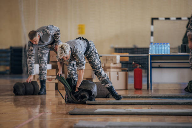 istock Soldiers preparing sleeping bags for civilians 1419297016