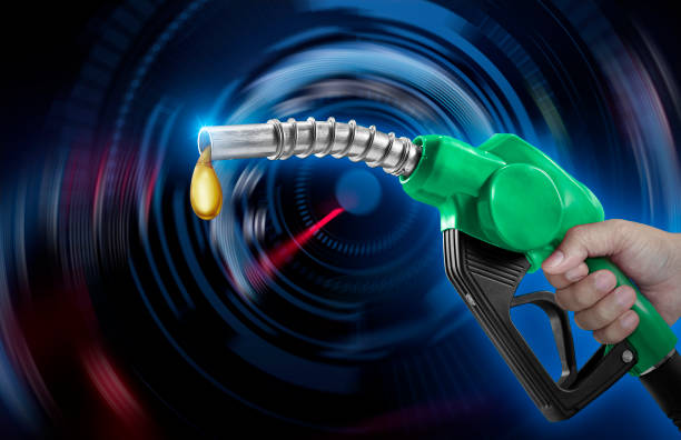 istock Holding a fuel injector against a speedometer on a blurred background 1419297779