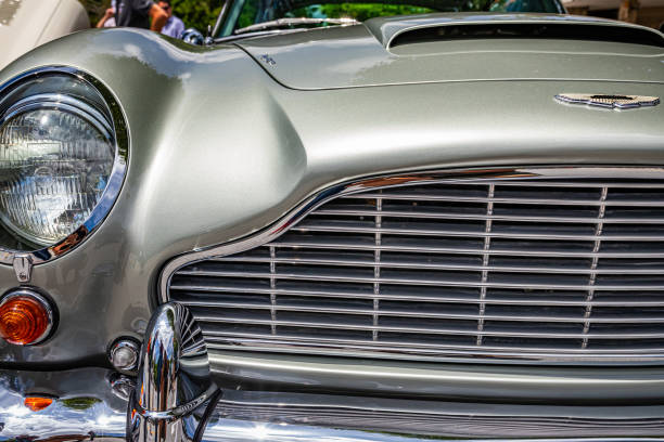 Highlands, NC - June 11, 2022: Close up detail view of a 1965 Aston Martin DB5 Hardtop Coupe headlights and grille at a local car show.