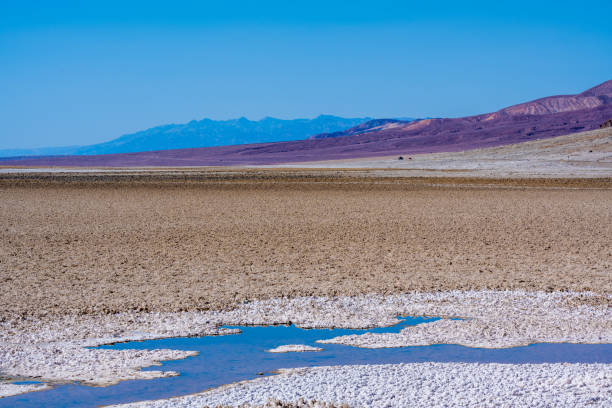 saltsee and Badwater basin in death valley in midday heat . At 282 feet below sea level, Badwater Basin is the lowest point in the US.