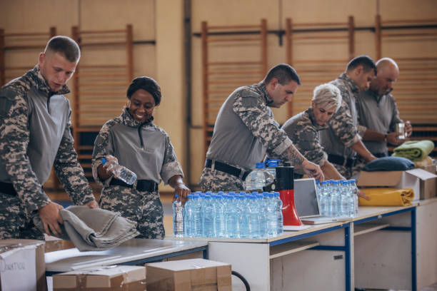 istock Soldiers preparing donations for civilians 1419300307