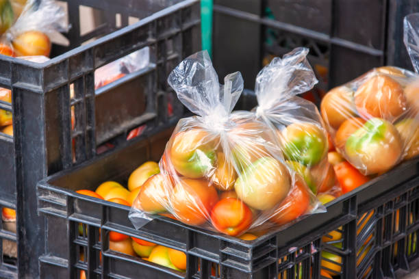 tomato crates few tomato crates stored at the farm farm produce storage stock pictures, royalty-free photos & images