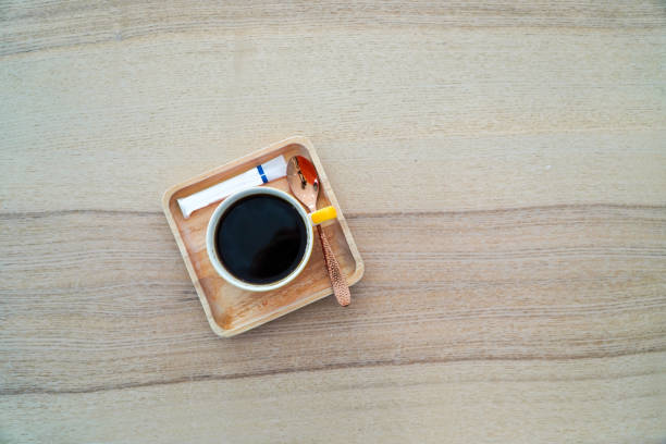 hot coffee mug on wooden table,coffee concept