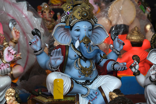 26 August 2022, Pune, India, Ganesha or Ganapati for sale at a shop on the event of Ganesh festival in India, Eco friendly God Ganesha Statue made from clay, selective focus.