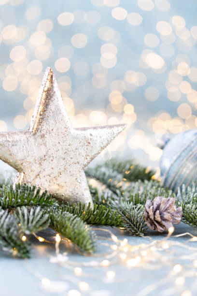 istock Christmas spruce with star and blurred shiny lights. 1419316009