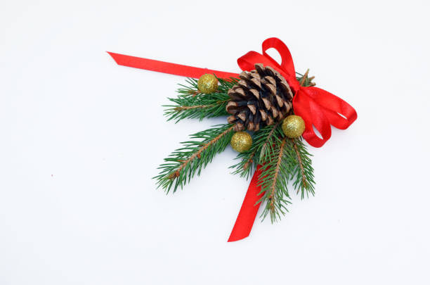 cone and Christmas toys on a branch