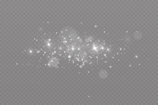 Dust sparks and stars shine with a special light. Christmas light effect. Glittering particles of magic dust.Vector sparkles on a transparent background.