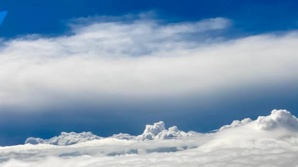 View from the plane to the landscape of the sky and heavy clouds