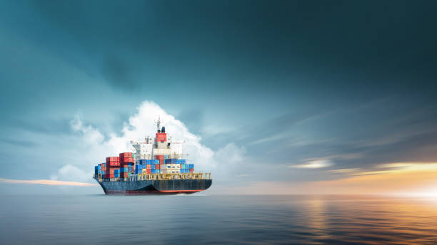 istock Container cargo ship in ocean at sunset dramatic sky background with copy space, Nautical vessel and sea freight shipping, International global business logistics transportation import export concept 1419320486