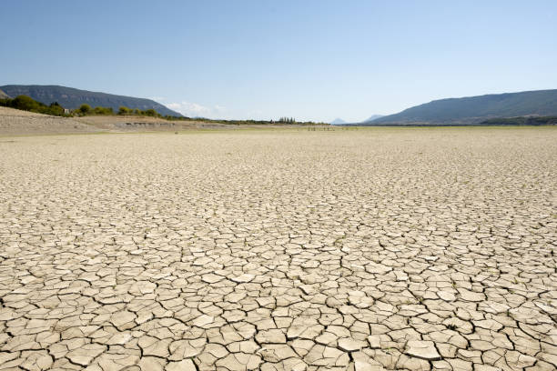istock Drought in the cracked earth, climate change concept. 1419323574