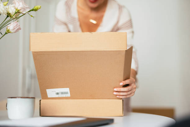 istock Unrecognizable Woman Opening the Carton Box Package (Copy Space) 1419325725