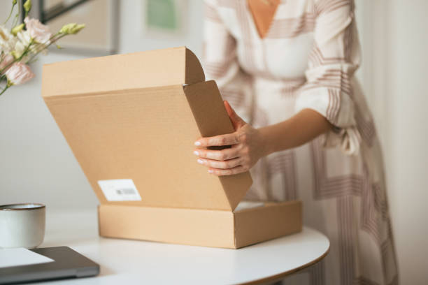 istock Unrecognizable Woman Opening the Carton Box Package (Copy Space) 1419325733