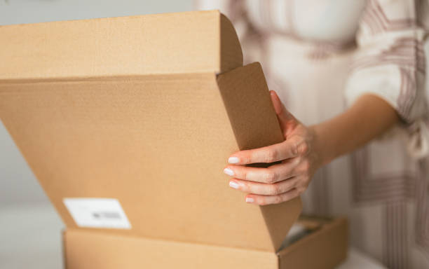 istock Unrecognizable Woman Opening the Carton Box Package (Copy Space) 1419325737