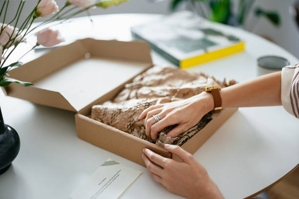 istock Anonymous Woman Unwrapping the Gift Box 1419325775