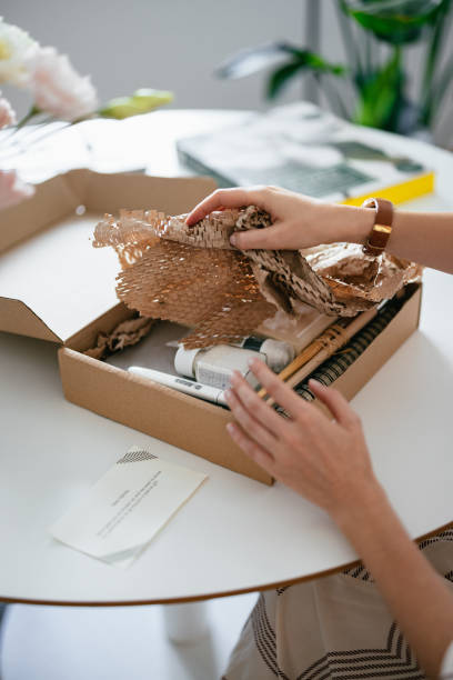 istock Anonymous Woman Unwrapping the Gift Box 1419325777