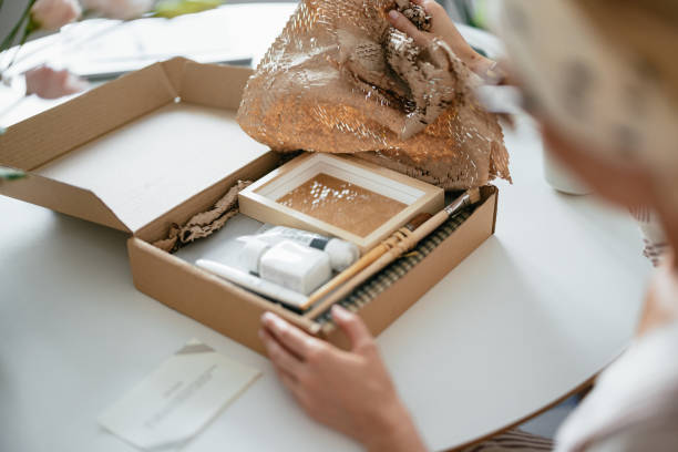 istock Anonymous Woman Unwrapping the Gift Box 1419325789
