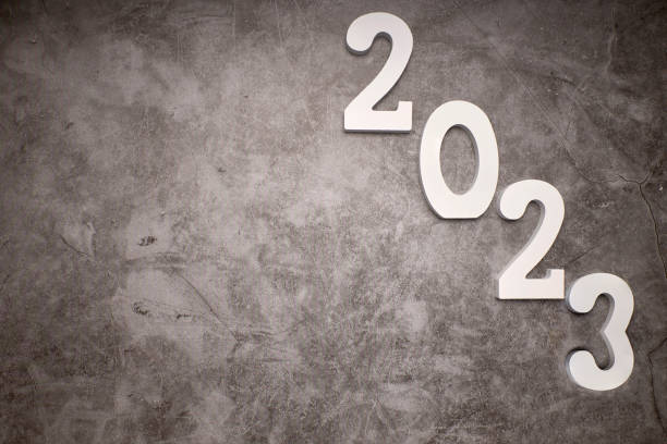istock Number 2023 on dark gray cement background. New Year 1419326170
