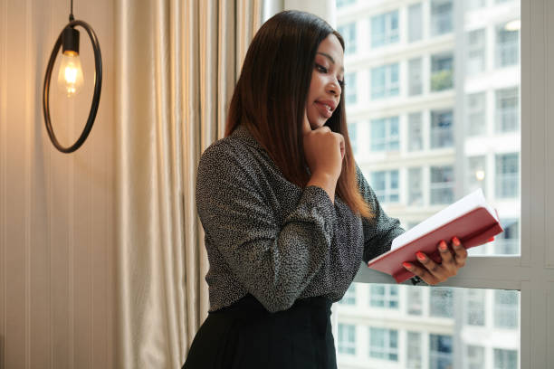 istock Businesswoman Checking Planner 1419328757