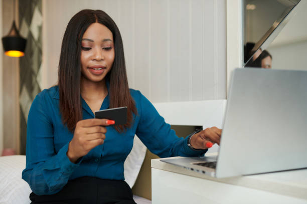 istock Businesswoman Entering Data from Credit Card 1419328809