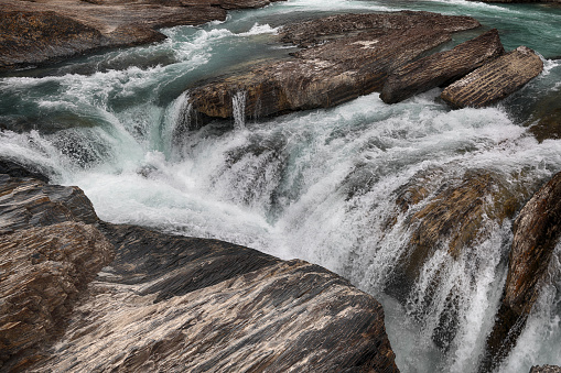 Hellen Hunt water fall in Colorado Springs Colorado USA. Unusual thick daytime fog on cold late autumn day. Long exposure.