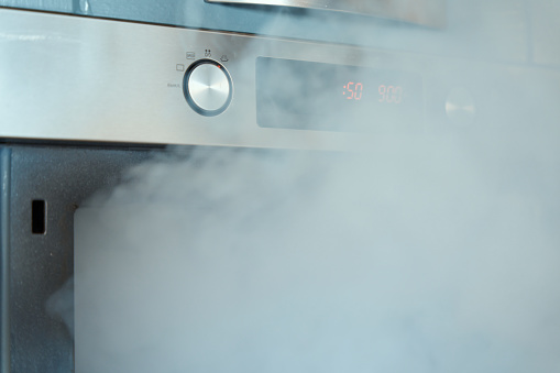 A fog coming from the modern kitchen stove