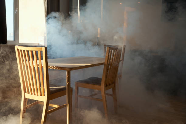 istock Kitchen furniture in a smoke in a sunset light coming through a window 1419329582