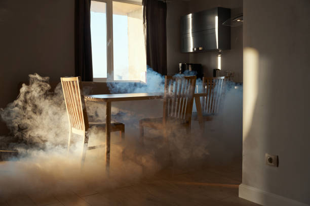 Modern kitchen in a smoke from the oven Kitchen in a smoke from the oven in a sunset light coming through a window kitchen on fire stock pictures, royalty-free photos & images