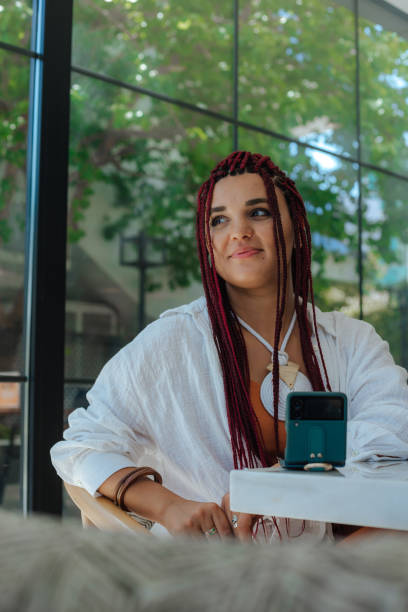 istock Joyful cute good looking young woman with dreadlocks, freelancer, working remotely 1419332508