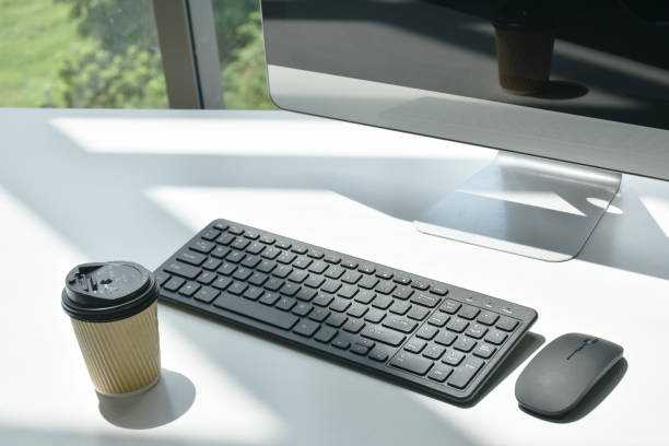 istock computer keyboard and mouse with hot coffee cup on woeking desk in office building 1419334568