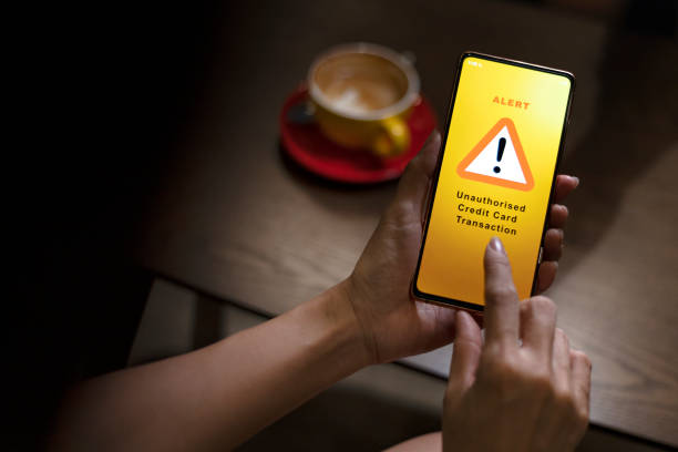 istock Financial fraud alert message on smartphone 1419336179