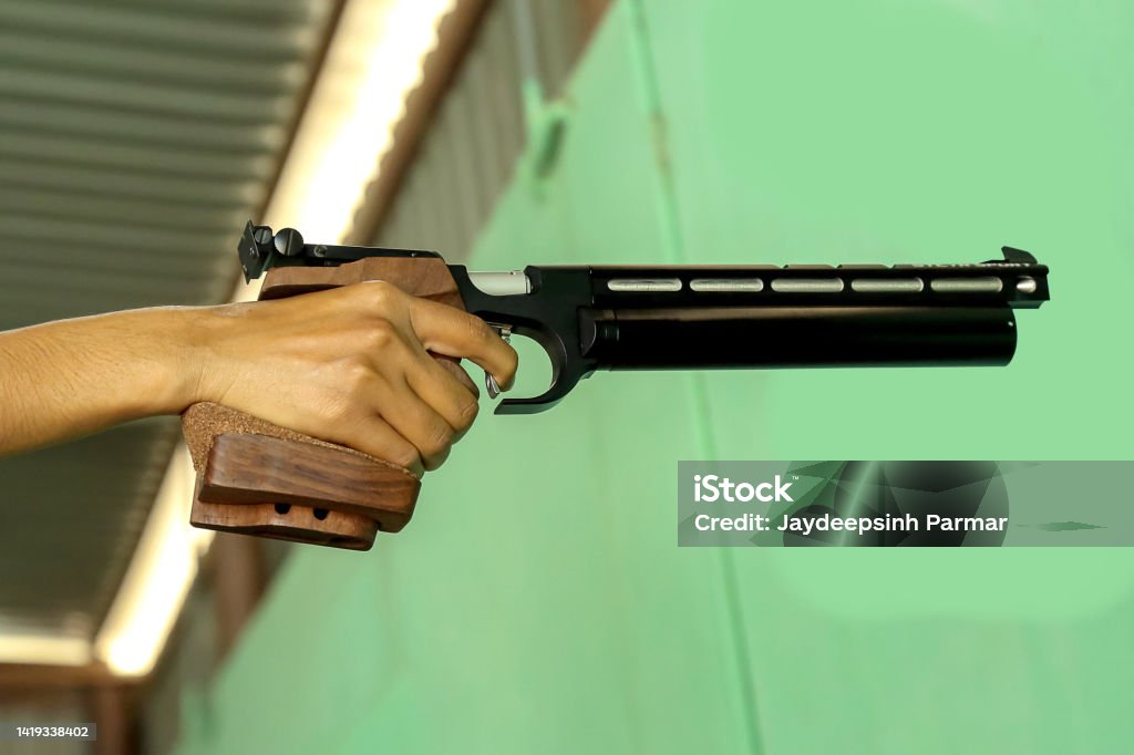 10m air pistol shooting practice shooter Air Rifle Stock Photo