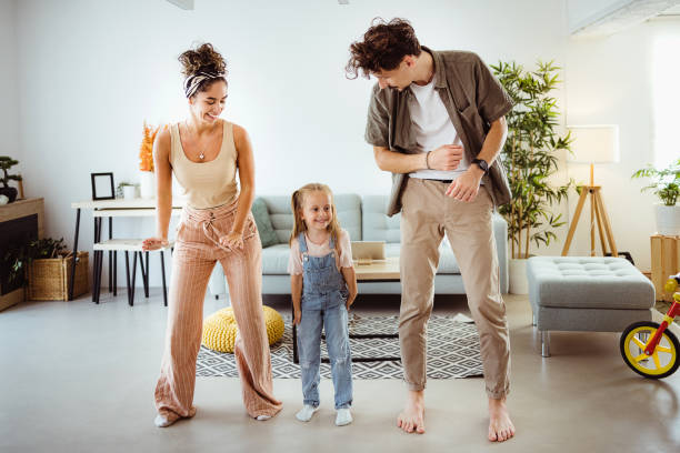 istock Happy family dancing at home 1419342591