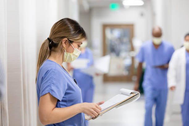 istock Nurse leans up against the wall 1419342637