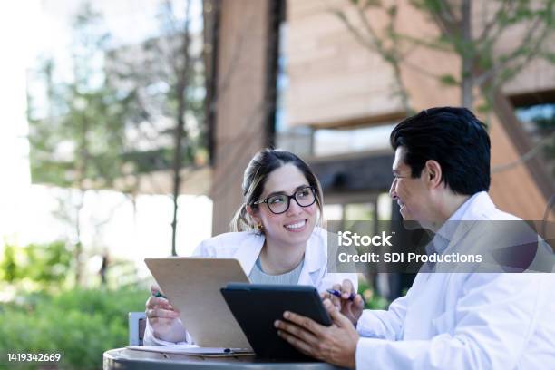 Medical Students Meet Stock Photo - Download Image Now - Mentorship, Doctor, Candid