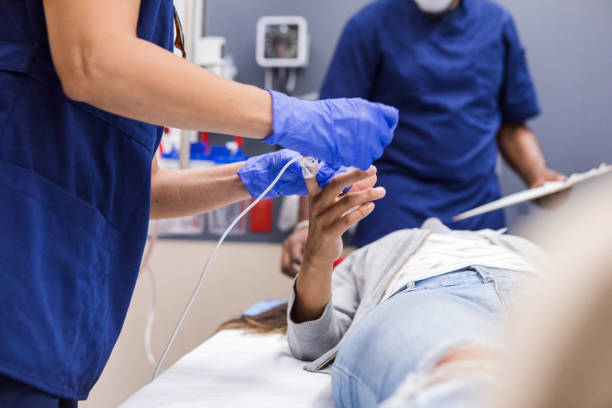 istock Unrecognizable nurse applies oxygen sensor to unrecognizable patient 1419346005