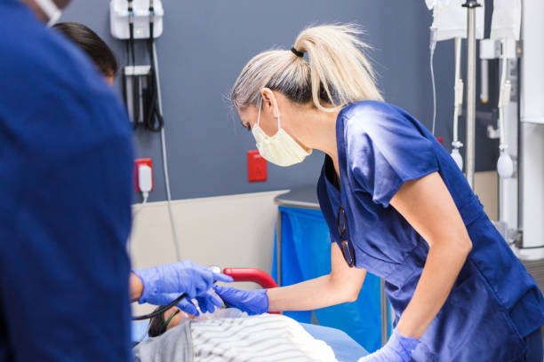 istock Nurses attend to female patient in emergency room 1419346056