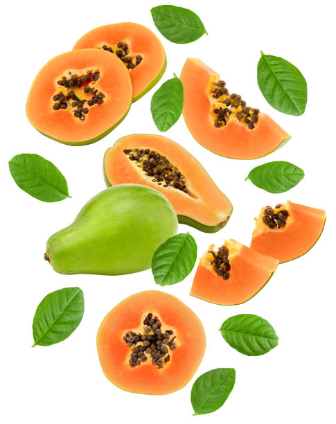 istock flying sliced ripe papaya fruit isolated on white background. exotic fruit. clipping path 1419347058