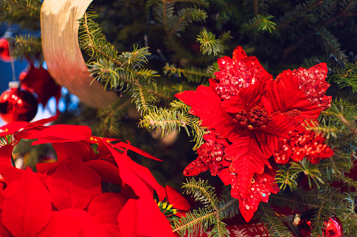 Closeup image of Glittery flower arrangement on a Christmas tree