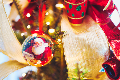 Closeup image of Christmas Ornaments on a beautifully decorated tree