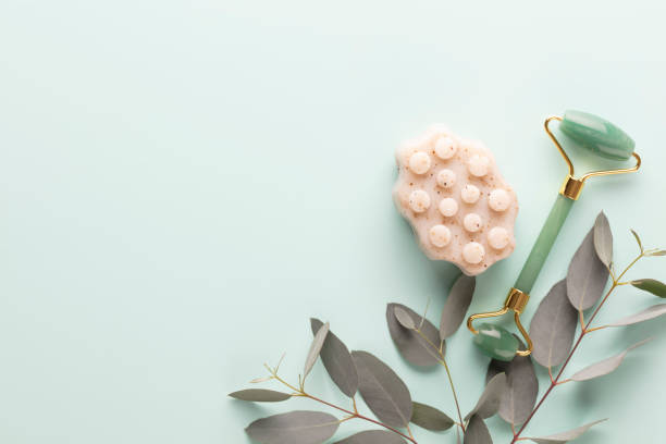 istock Cellulite soap, eucalyptus  and other spa objects on green background. Top view. Skin care, body treatment concept. 1419351653