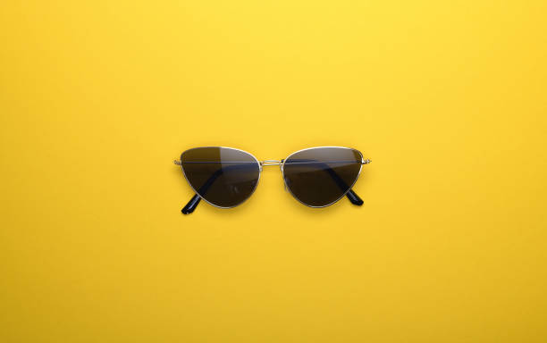 istock Sunglasses on a yellow background. 1419356286